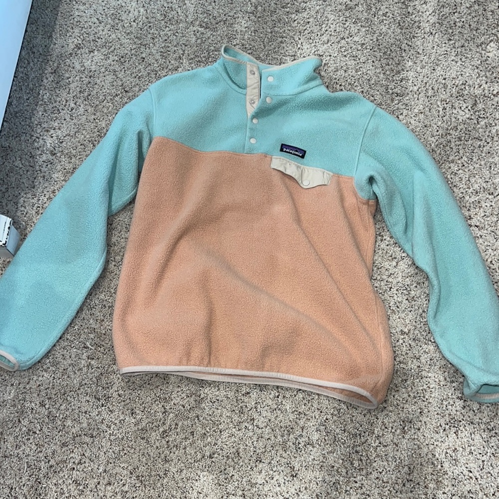 Patagonian half button jacket, size medium, color turquoise, and peach.